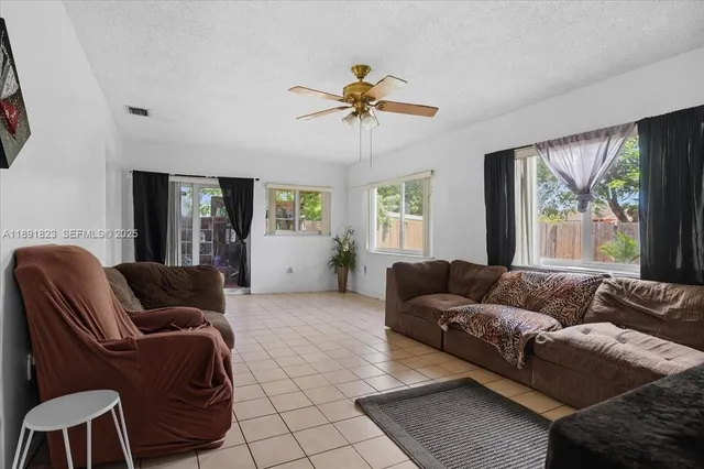 a living room with furniture and a window