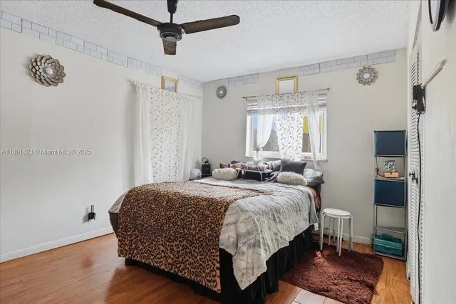a bathroom with a granite countertop toilet sink and mirror