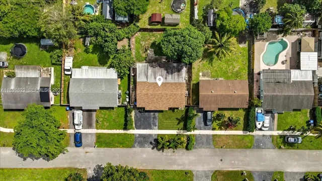 an aerial view of residential houses with outdoor space