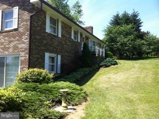 14731 Hicksville Road Clear Spring, MD 21722 - Photo 2 of 26 left side of house, master BR up and fam. rm below