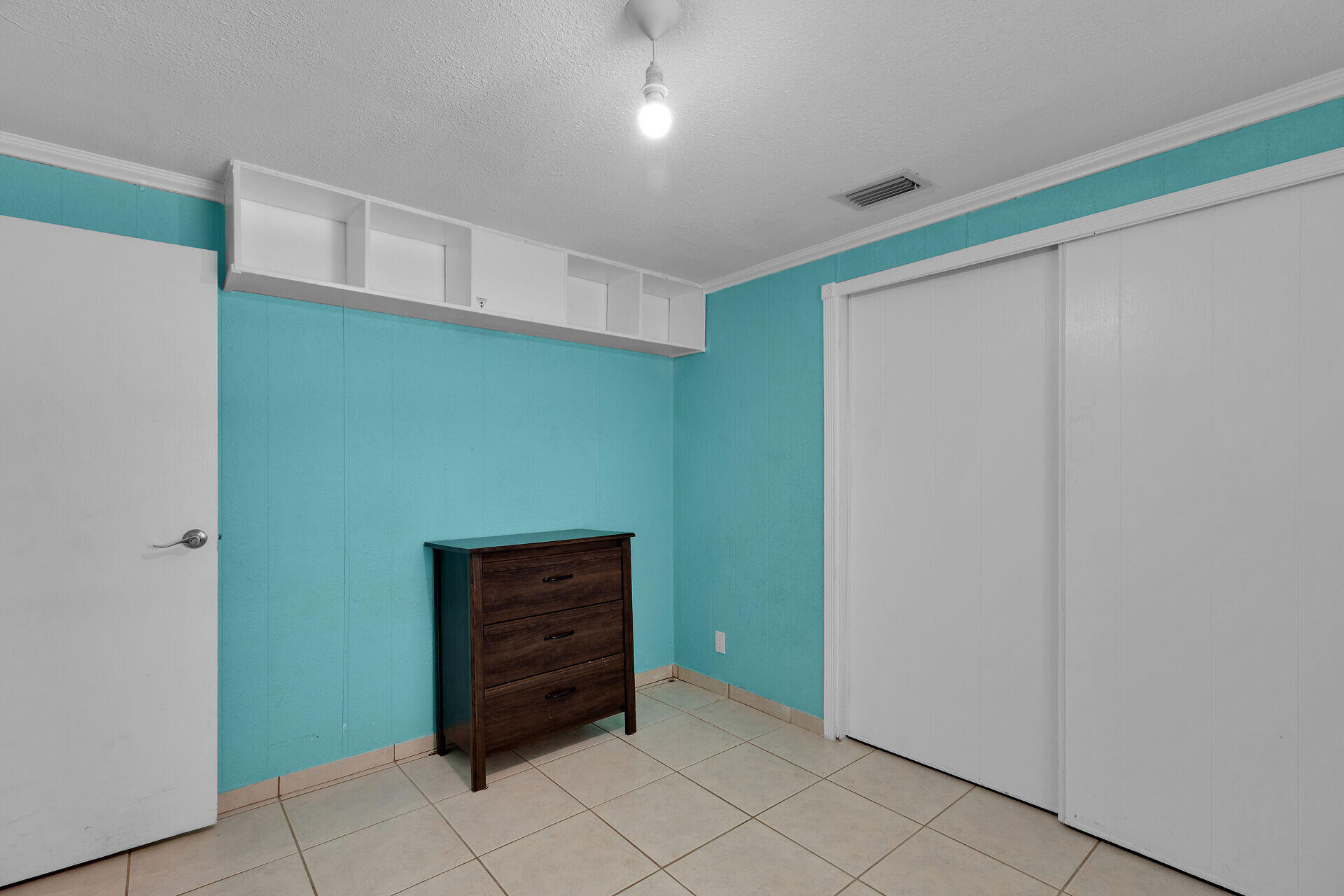 144 Sunset Lane Tavernier, FL 33070 - Photo 18 of 49 a view of room with cabinets and a ceiling fan