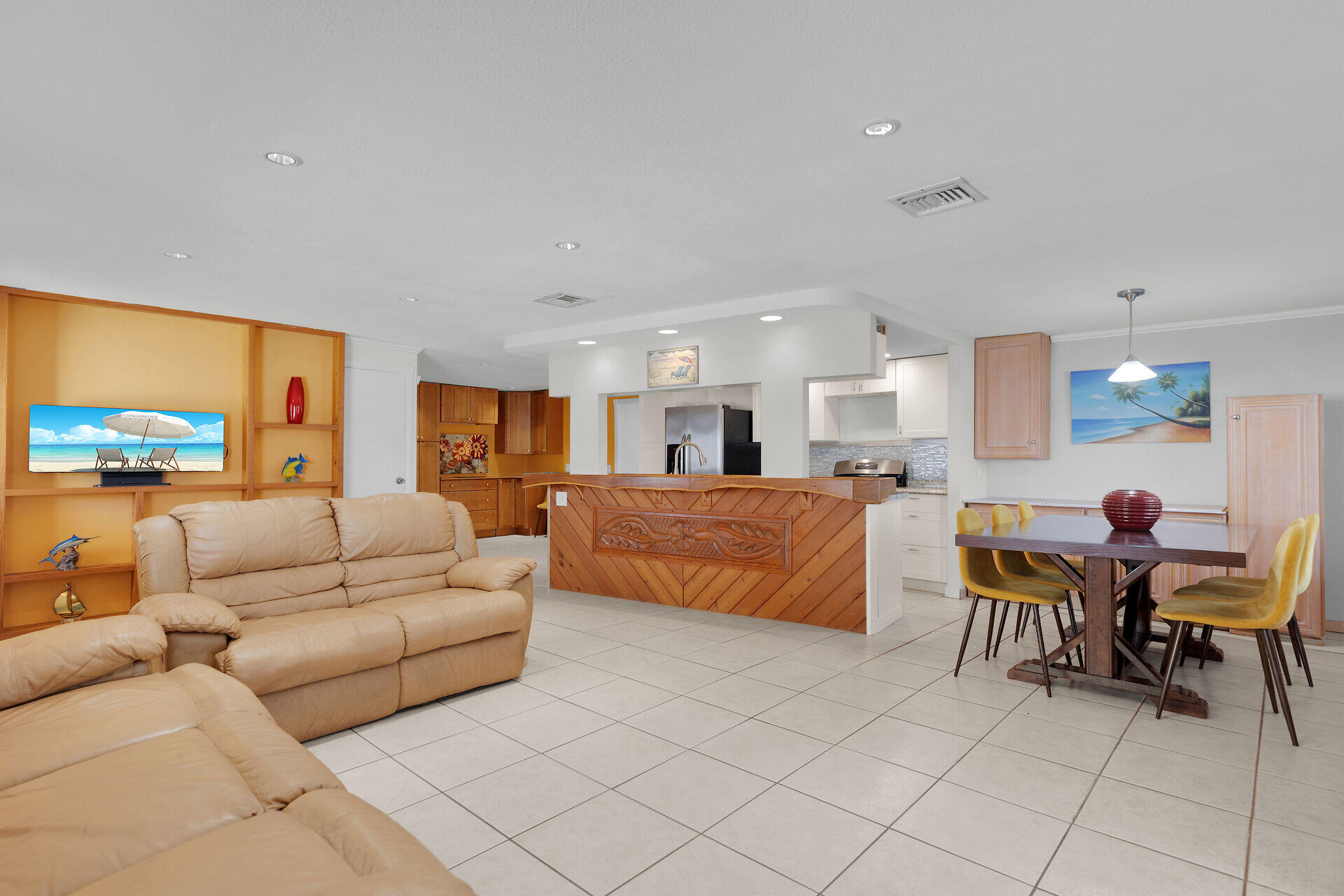 144 Sunset Lane Tavernier, FL 33070 - Photo 19 of 49 a living room with furniture and a flat screen tv