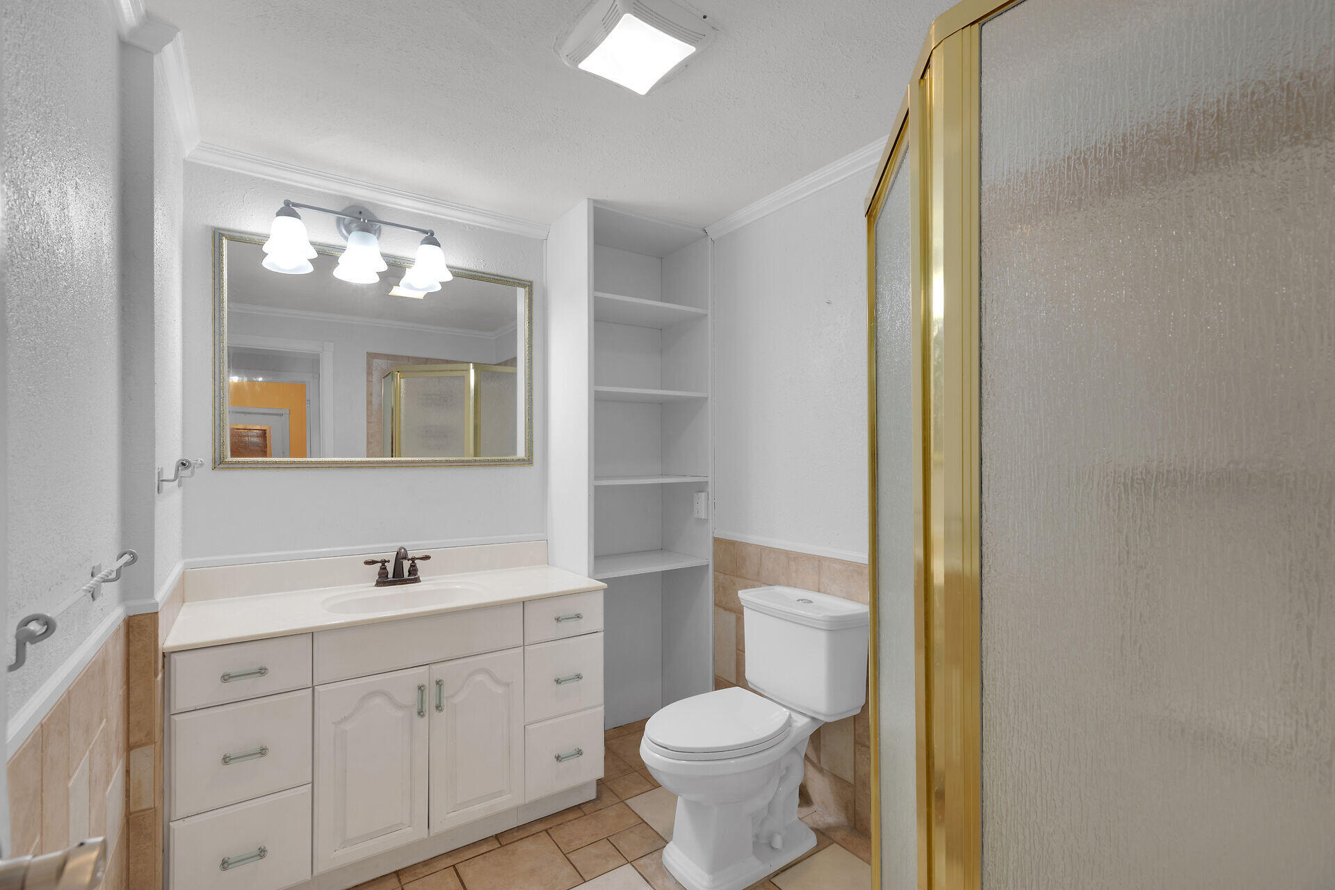 144 Sunset Lane Tavernier, FL 33070 - Photo 20 of 49 a bathroom with a toilet sink and mirror