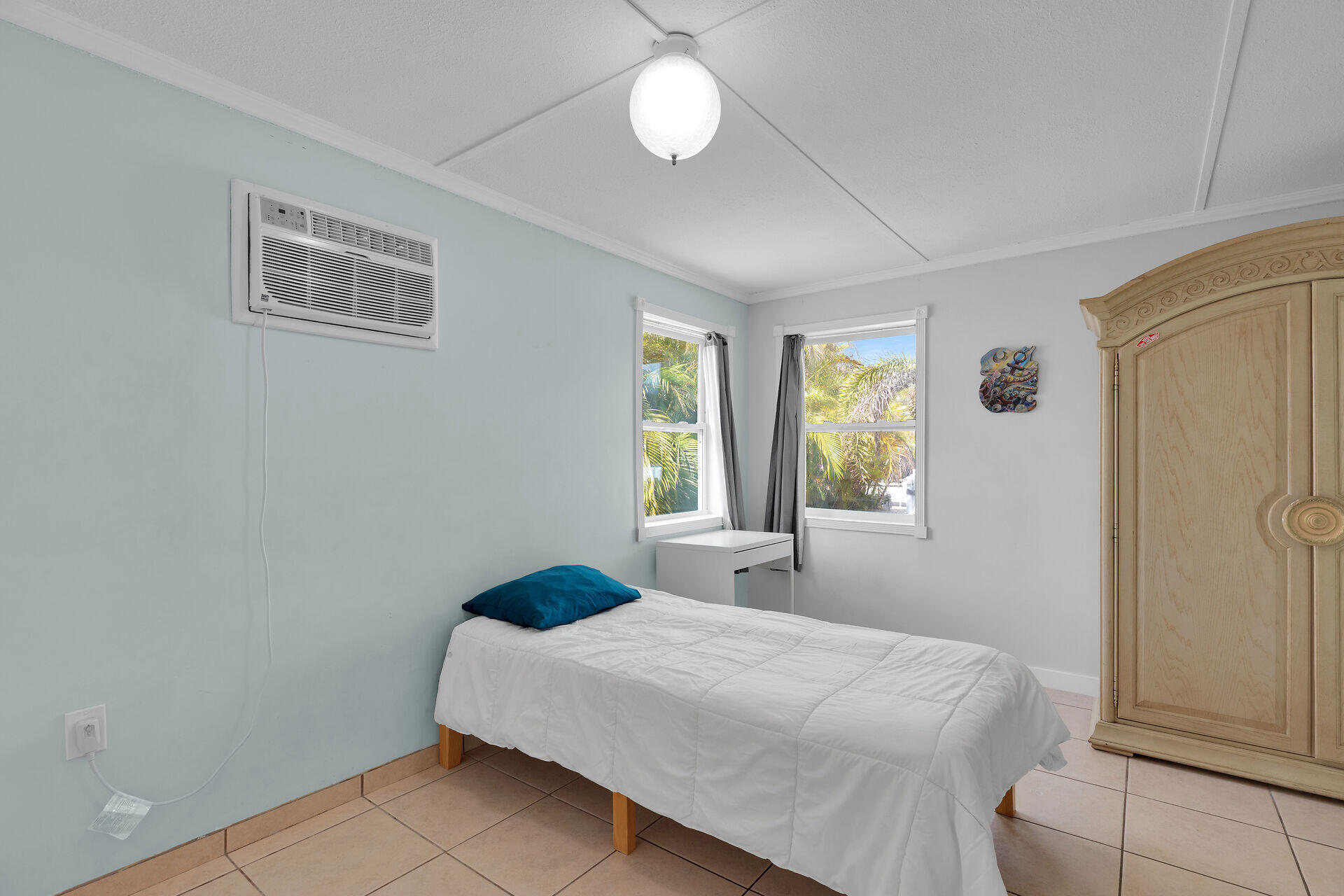 144 Sunset Lane Tavernier, FL 33070 - Photo 23 of 49 a bedroom with a bed and window