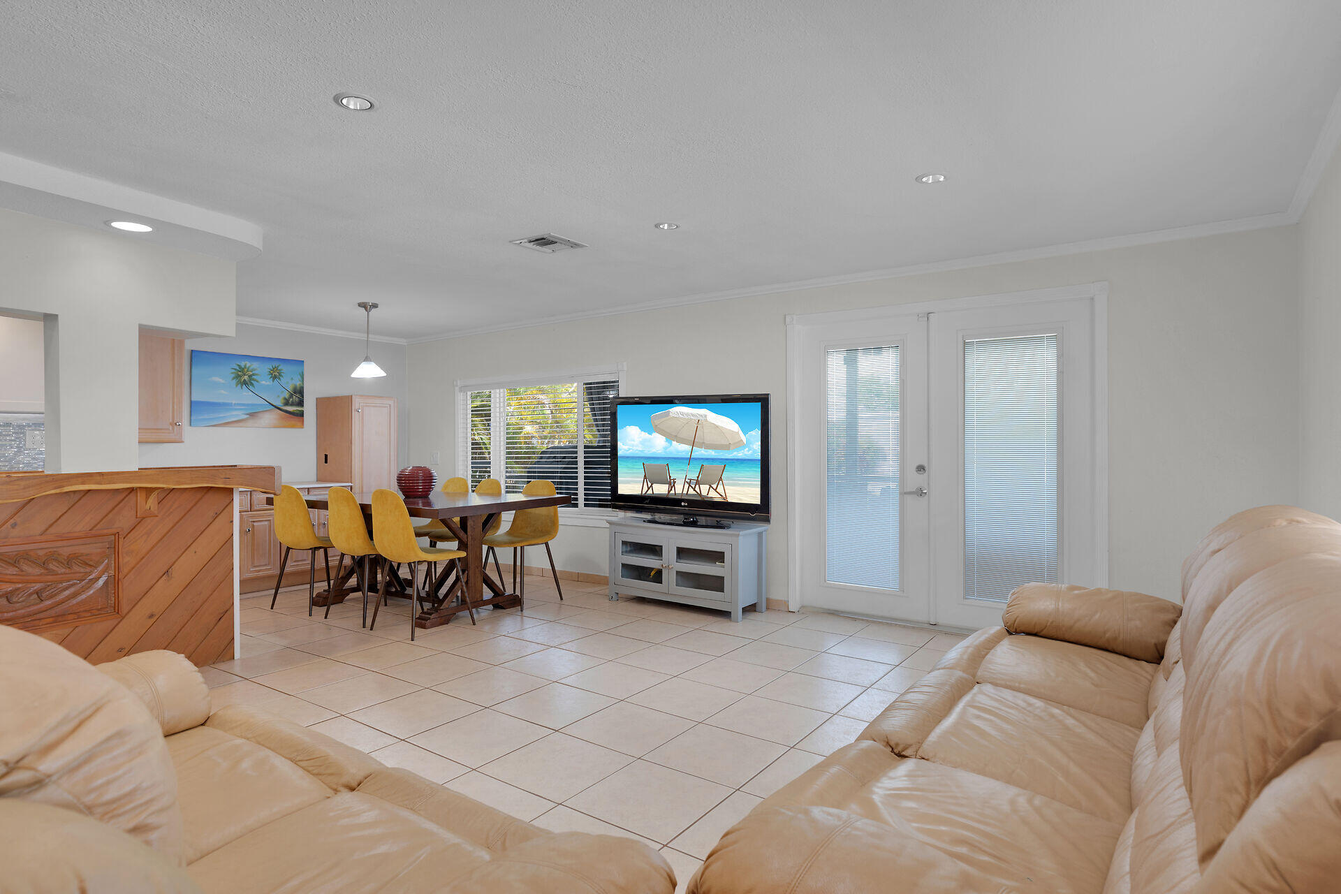 144 Sunset Lane Tavernier, FL 33070 - Photo 24 of 49 a living room with furniture and a flat screen tv