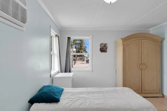 a bedroom with a bed and a cabinets