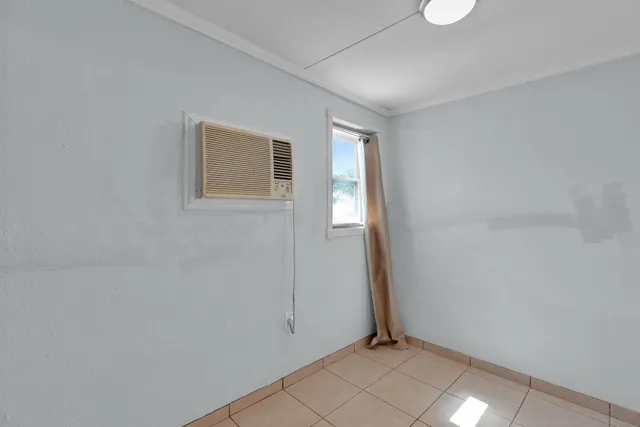 a view of a house with backyard and trees