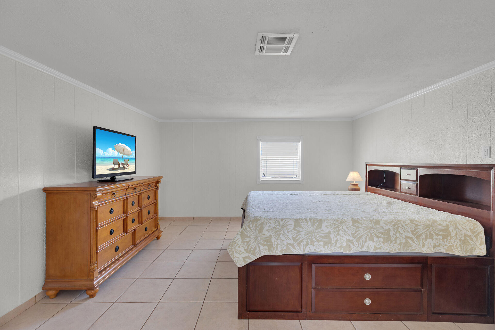 144 Sunset Lane Tavernier, FL 33070 - Photo 28 of 49 a bedroom with a bed and a dresser