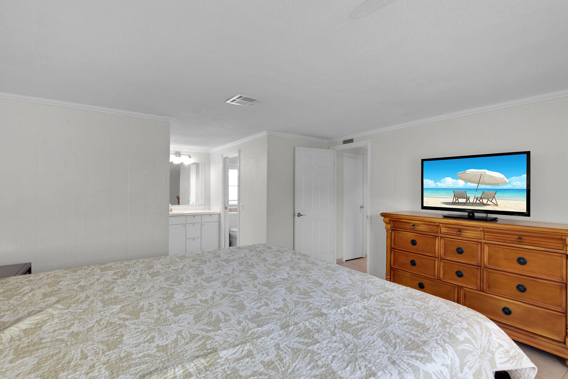 144 Sunset Lane Tavernier, FL 33070 - Photo 31 of 49 a bedroom with a bed and a flat screen tv in it