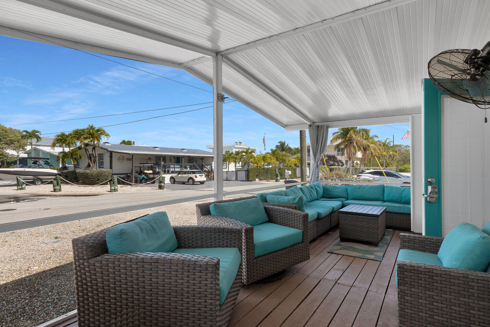 144 Sunset Lane Tavernier, FL 33070 - Photo 38 of 49 a living room with furniture and a floor to ceiling window