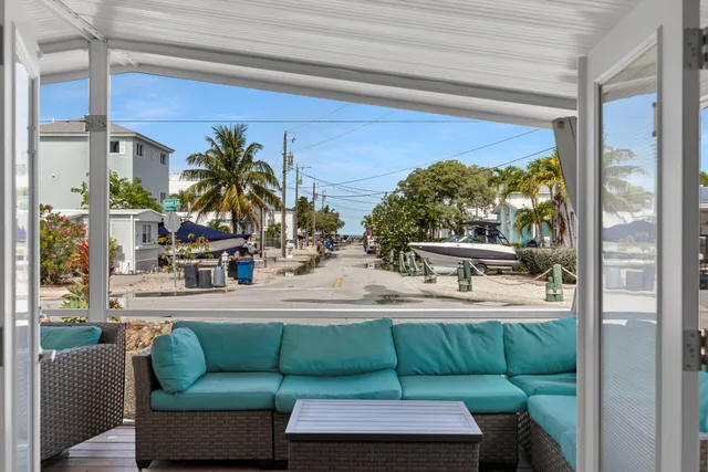 a kitchen with stainless steel appliances granite countertop a refrigerator a stove and a sink