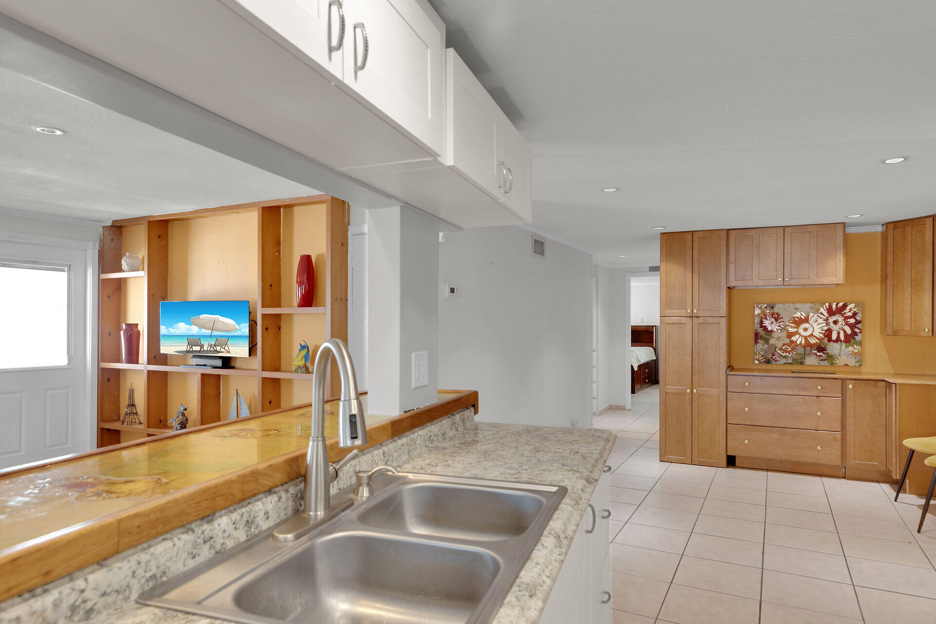 144 Sunset Lane Tavernier, FL 33070 - Photo 43 of 49 a kitchen with stainless steel appliances a sink and cabinets