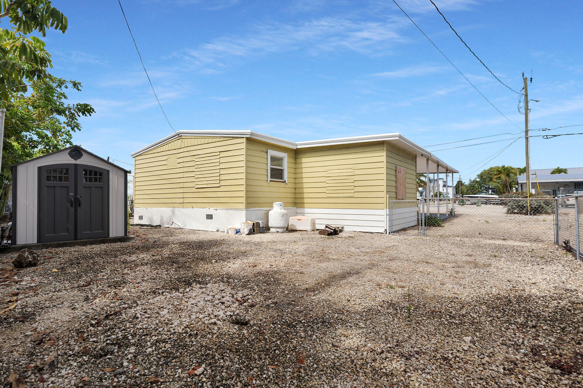 144 Sunset Lane Tavernier, FL 33070 - Photo 45 of 49 a view of a house with backyard and trees