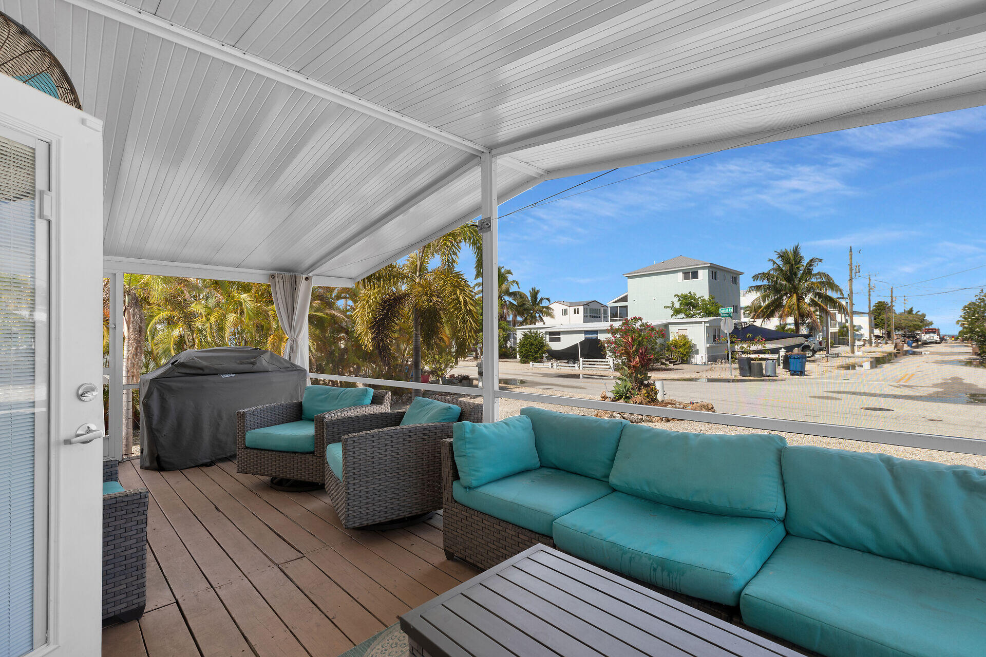 144 Sunset Lane Tavernier, FL 33070 - Photo 9 of 49 a living room with furniture and a large window