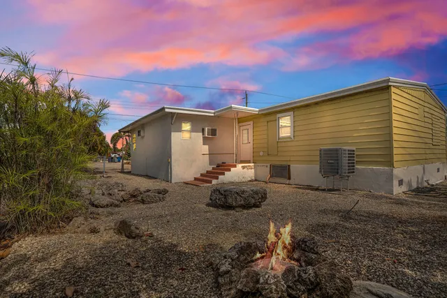 a bedroom with a bed and a flat screen tv in it