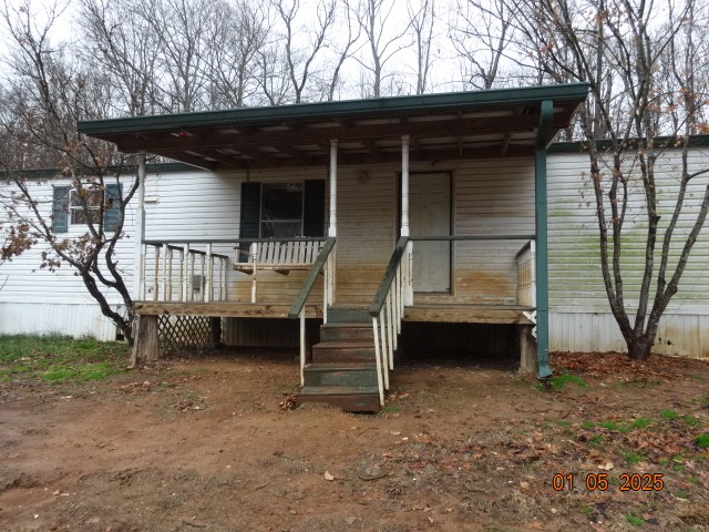 1882 Jordan Road Chapmansboro, TN 37035 - Photo 2 of 13 a front view of a house with garden