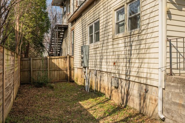 a view of a pathway with a backyard