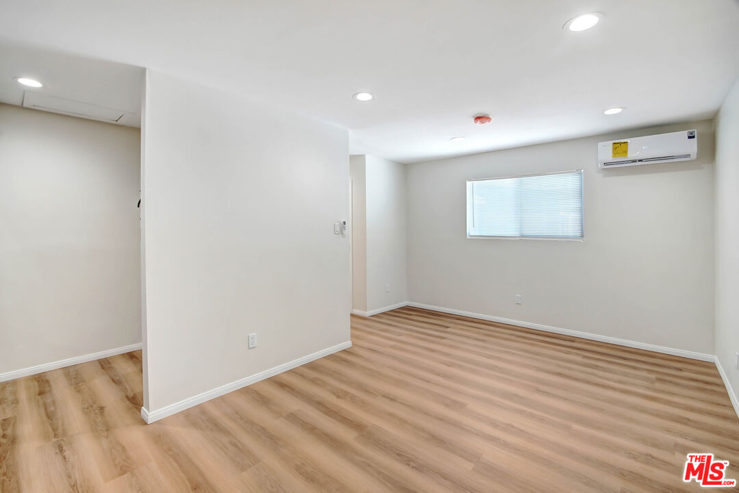 613 Pico Street San Fernando, CA 91340 - Photo 5 of 10 a view of an empty room with wooden floor