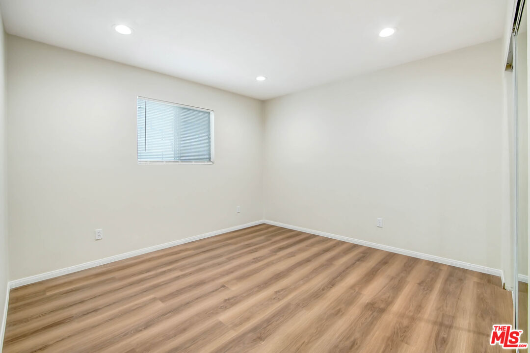 613 Pico Street San Fernando, CA 91340 - Photo 7 of 10 a view of room with wooden floor and fan