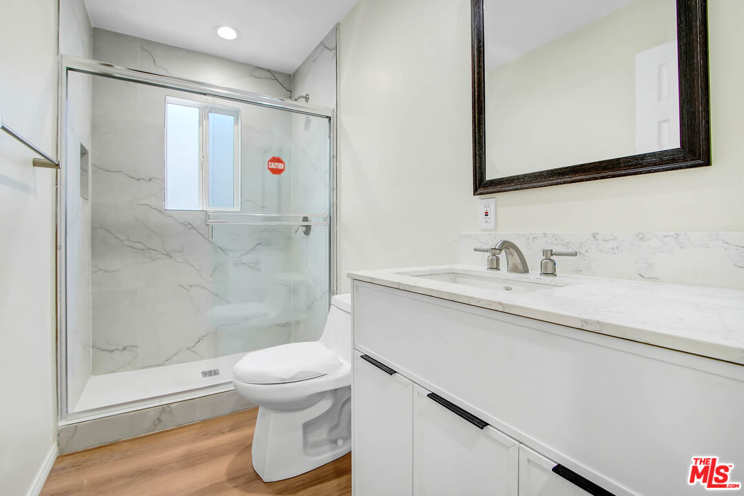 613 Pico Street San Fernando, CA 91340 - Photo 8 of 10 a bathroom with a sink toilet and shower