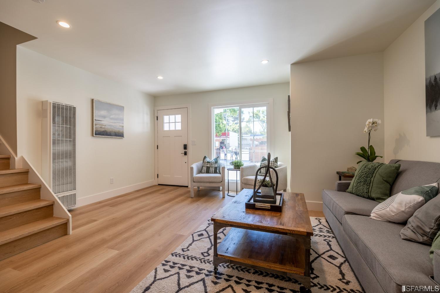 951 University Avenue Berkeley, CA 94710 - Photo 14 of 34 a living room with furniture and wooden floor