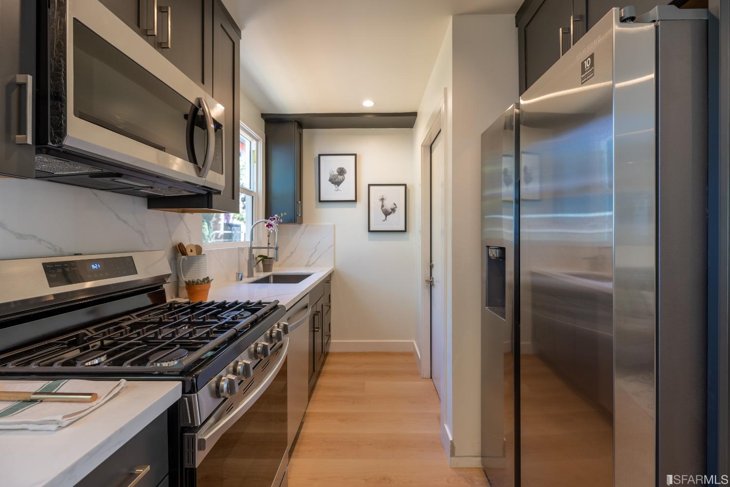 951 University Avenue Berkeley, CA 94710 - Photo 16 of 34 a kitchen with stainless steel appliances granite countertop a stove and a refrigerator