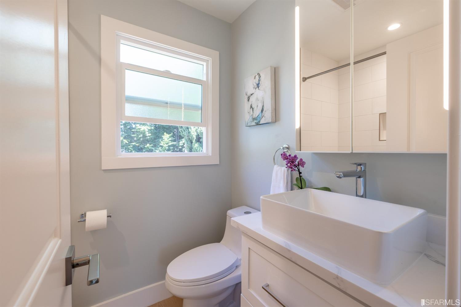 951 University Avenue Berkeley, CA 94710 - Photo 21 of 34 a bathroom with a sink a toilet and a window