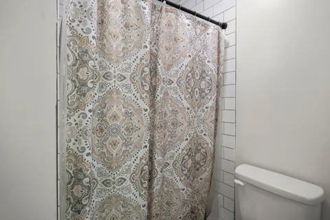 a utility room with sink dryer and washer