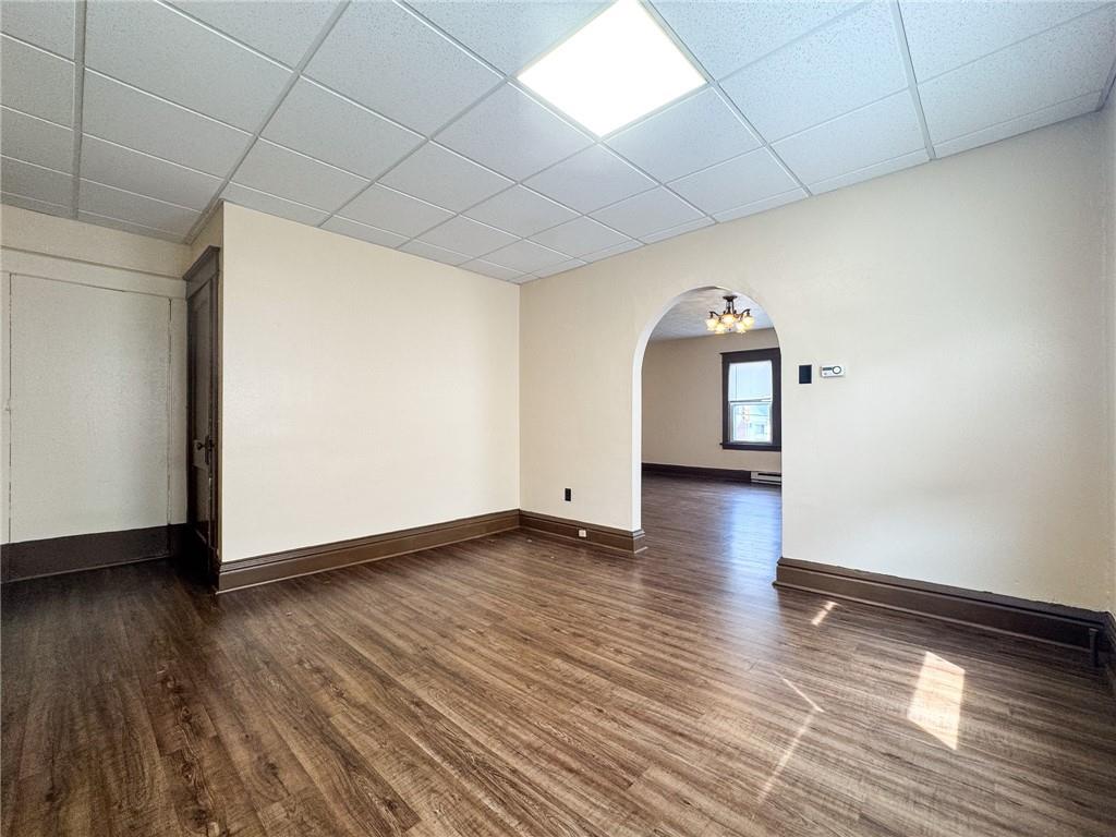 811 Wilmington Road, Unit 6 New Castle, PA 16101 - Photo 6 of 16 a view of a livingroom with wooden floor and window