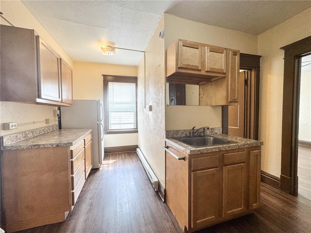 811 Wilmington Road, Unit 6 New Castle, PA 16101 - Photo 9 of 16 a kitchen with stainless steel appliances granite countertop a stove and a refrigerator