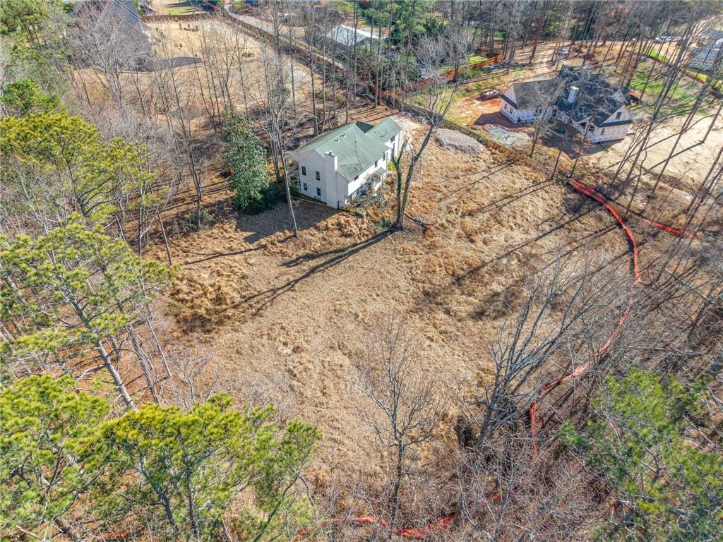 16520 Hopewell Road Alpharetta, GA 30004 - Photo 3 of 6 a view of a backyard of the house