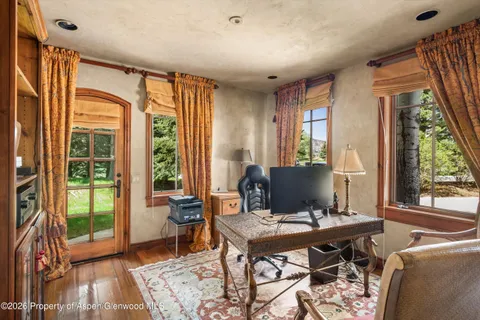 a workspace with furniture and a window