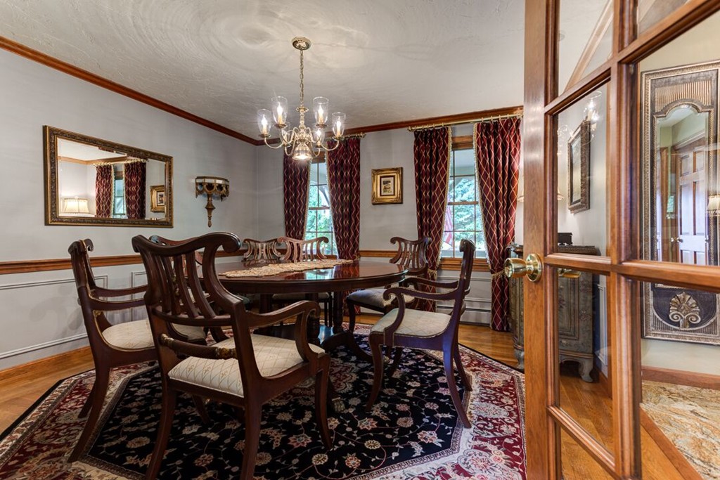 20 Indigo Farm Road North Smithfield, RI 02830 - Photo 23 of 30 a view of a dining room with furniture and a chandelier
