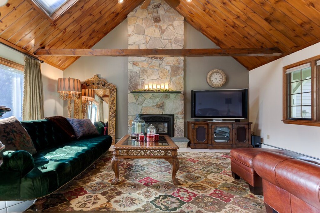 20 Indigo Farm Road North Smithfield, RI 02830 - Photo 30 of 30 a living room with furniture a flat screen tv and a fireplace