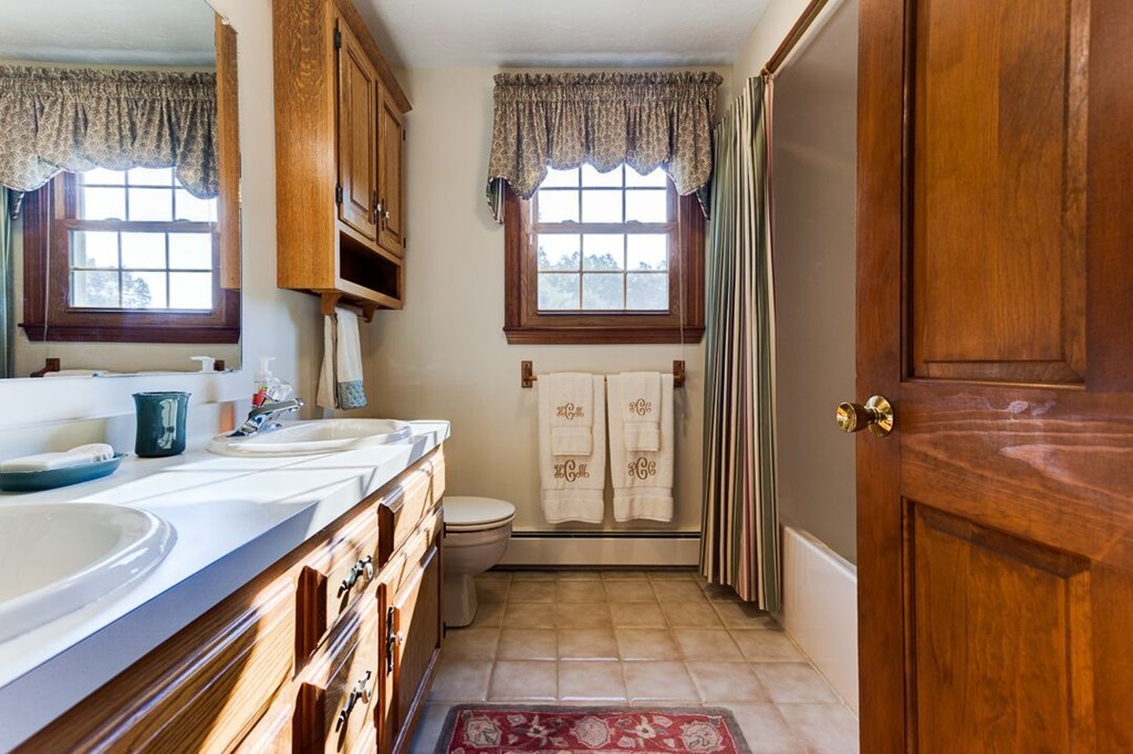 20 Indigo Farm Road North Smithfield, RI 02830 - Photo 8 of 30 a bathroom with a sink a vanity and a mirror
