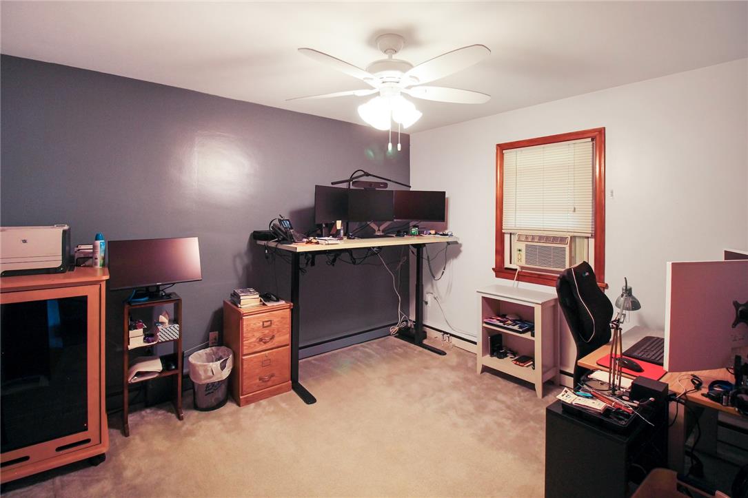 1256 Ridge Avenue Whitehall, PA 18052 - Photo 26 of 43 Comfortable home office featuring a ceiling fan, plush carpeting, and a window unit for cooling.