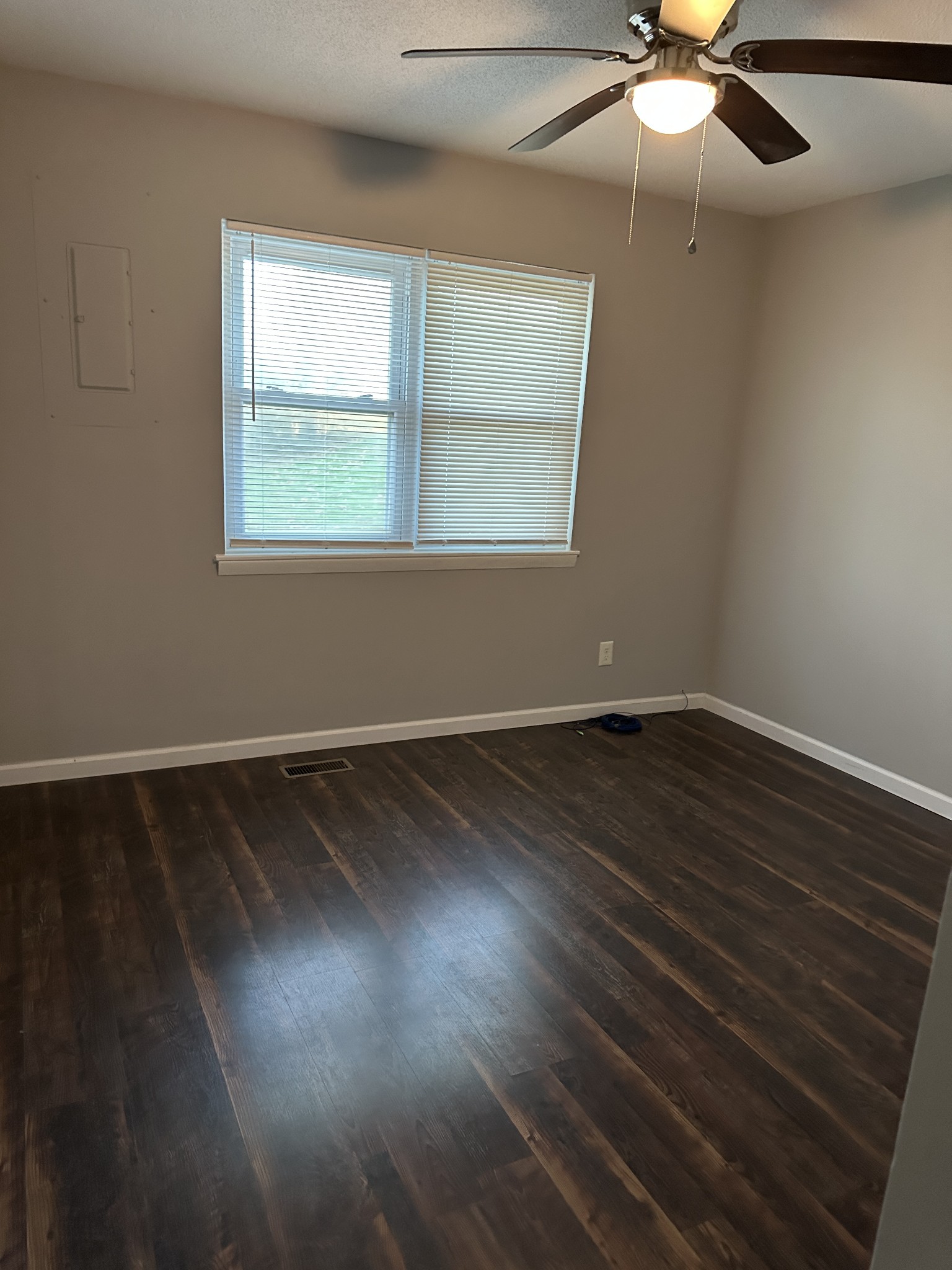 69 Hasty Hollow Road Lynchburg, TN 37352 - Photo 15 of 20 an empty room with wooden floor and windows