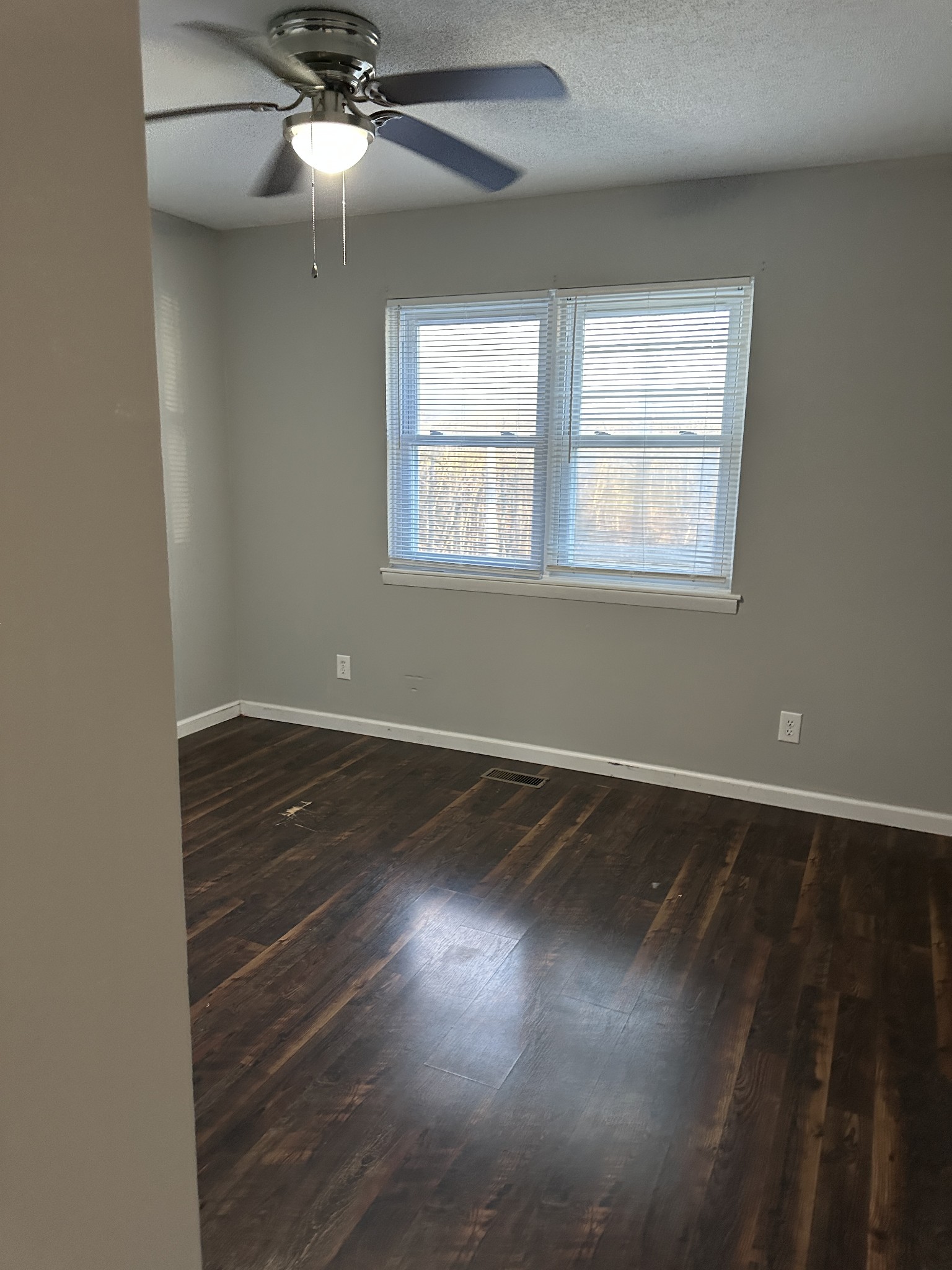 69 Hasty Hollow Road Lynchburg, TN 37352 - Photo 16 of 20 an empty room with wooden floor and windows