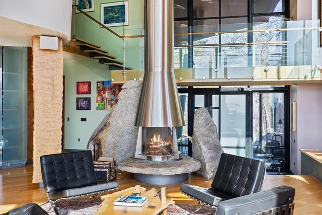 a living room with furniture and a floor to ceiling window