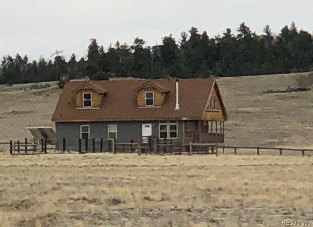 4663 Seneca Road Hartsel, CO 80449 - Photo 22 of 25 a front view of a house with a yard