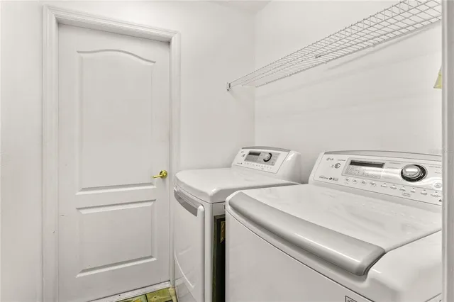 a utility room with dryer and washer