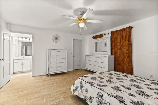a bedroom with a bed and a cabinets