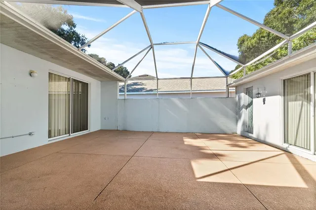 a view of backyard with a white roof and door