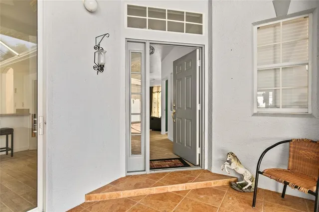 a view of a livingroom with furniture and staircase