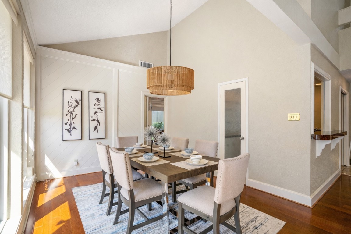1306 Riverview Court Houston, TX 77077 - Photo 11 of 43 a view of a dining room with furniture and wooden floor