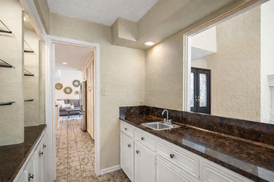 1306 Riverview Court Houston, TX 77077 - Photo 12 of 43 a bathroom with a sink and a mirror