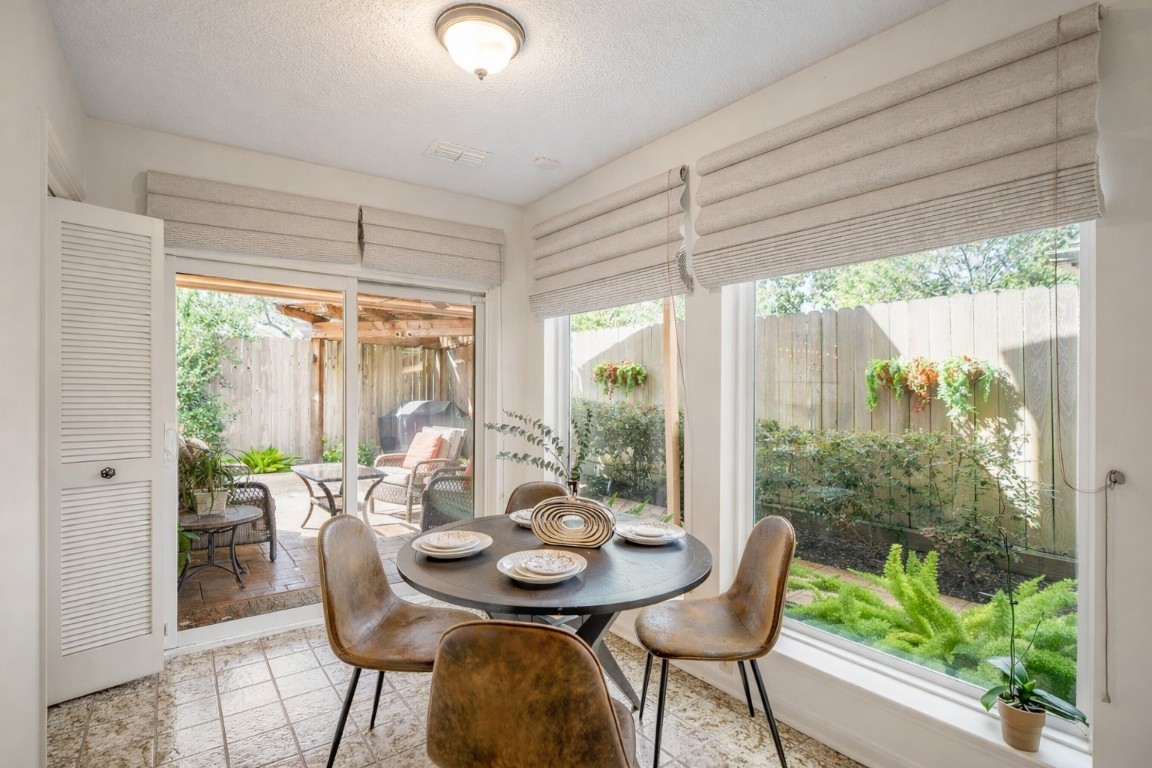 1306 Riverview Court Houston, TX 77077 - Photo 14 of 43 a view of a dining room with furniture window and outside view