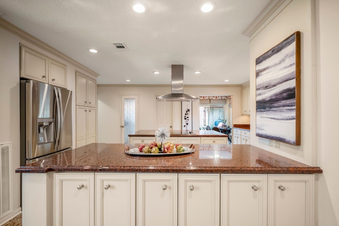 1306 Riverview Court Houston, TX 77077 - Photo 15 of 43 a kitchen with granite countertop a sink and refrigerator