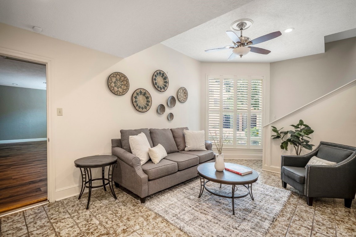 1306 Riverview Court Houston, TX 77077 - Photo 18 of 43 a living room with furniture and a large window