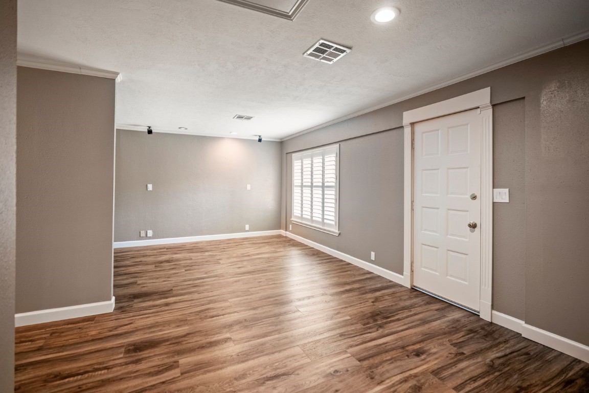 1306 Riverview Court Houston, TX 77077 - Photo 21 of 43 a view of an empty room with wooden floor and a window